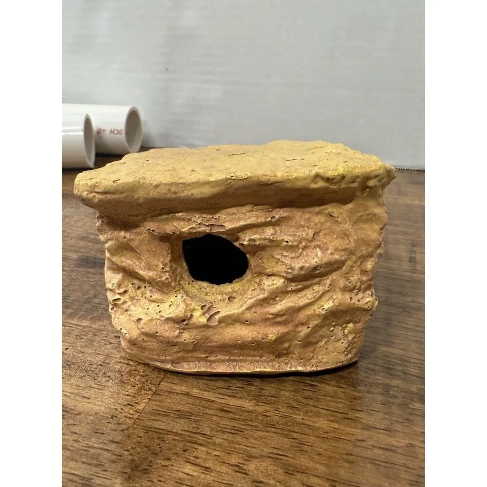 miscellaneous  Reptile supplies, One hide, PVC tubing, Food and water bowl ￼